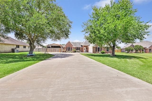 5810 Dixie Ln, Baytown, TX 77523 - view of front of home with brick siding and concrete driveway