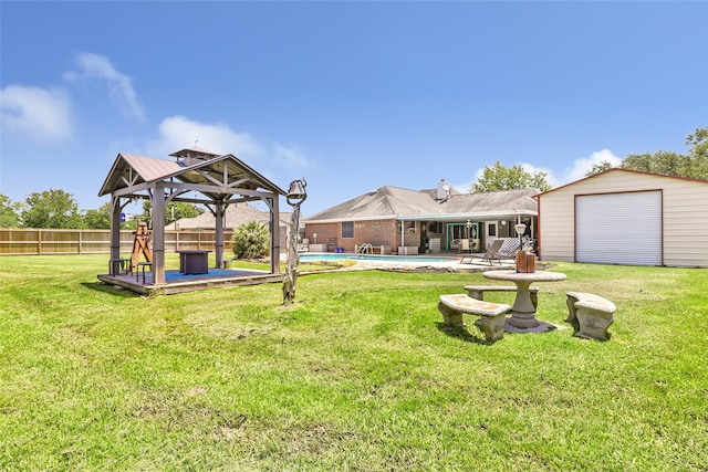 5810 Dixie Ln, Baytown, TX 77523 - fenced backyard featuring a gazebo and an outdoor structure