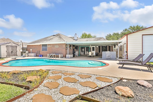 5810 Dixie Ln, Baytown, TX 77523 - outdoor pool with a shed and a patio
