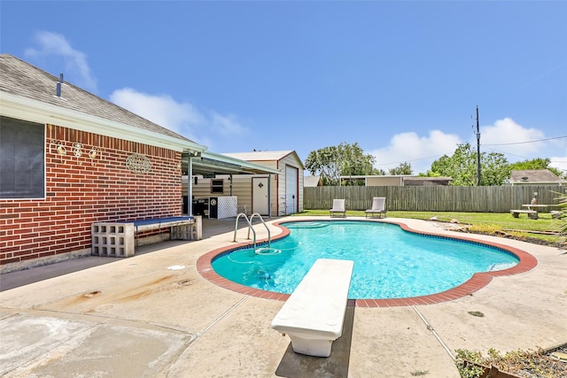 5810 Dixie Ln, Baytown, TX 77523 - view of swimming pool with a patio area, a shed, and a diving board