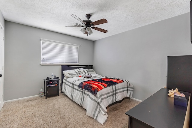 5810 Dixie Ln, Baytown, TX 77523 - bedroom with light colored carpet, a textured ceiling, and ceiling fan