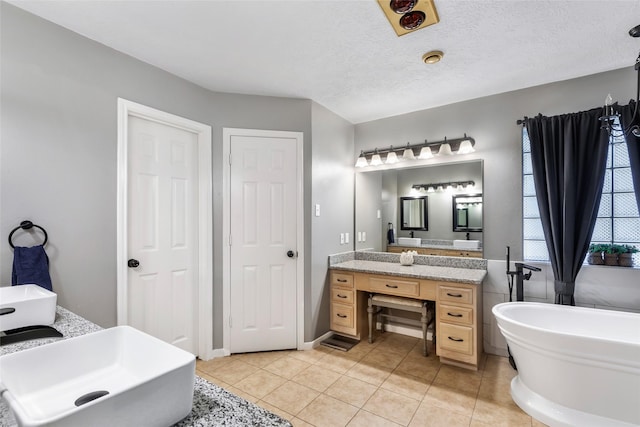 5810 Dixie Ln, Baytown, TX 77523 - full bath featuring a soaking tub, vanity, and tile patterned floors