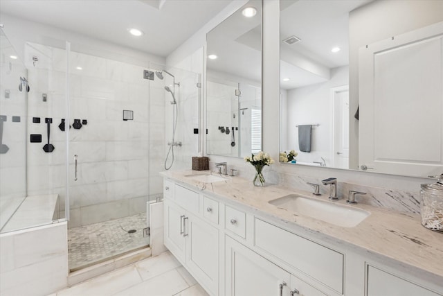 6019 Matthew Oaks Pl, Houston, TX 77007 - bathroom with a stall shower, double vanity, recessed lighting, and tile patterned flooring