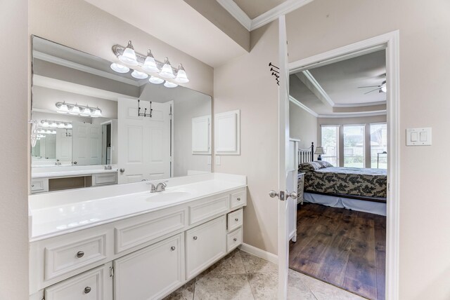2215 Dali Ln, Missouri City, TX 77459 - ensuite bathroom featuring ornamental molding, vanity, ceiling fan, baseboards, and tile patterned floors