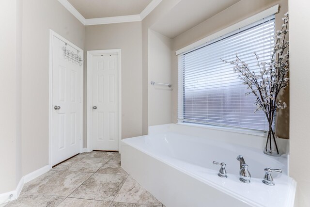2215 Dali Ln, Missouri City, TX 77459 - bathroom with crown molding, a bath, and baseboards