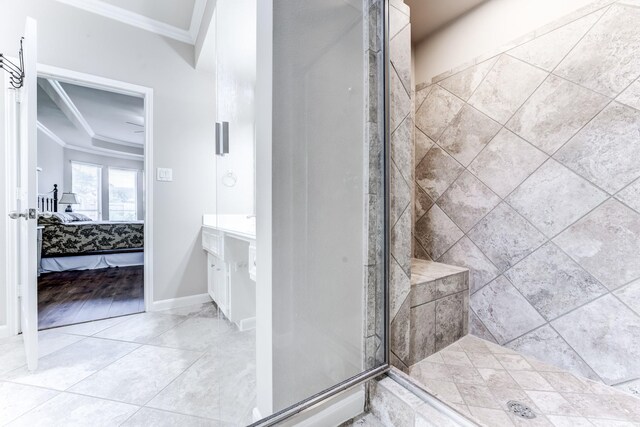 2215 Dali Ln, Missouri City, TX 77459 - ensuite bathroom featuring crown molding, a shower stall, vanity, and baseboards