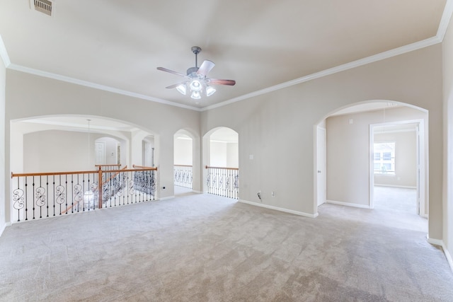 2215 Dali Ln, Missouri City, TX 77459 - empty room with ceiling fan, carpet floors, ornamental molding, baseboards, and arched walkways