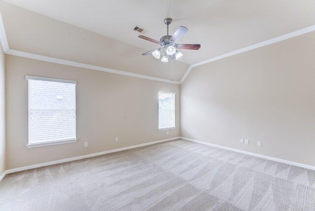 2215 Dali Ln, Missouri City, TX 77459 - empty room with crown molding, vaulted ceiling, light carpet, ceiling fan, and baseboards