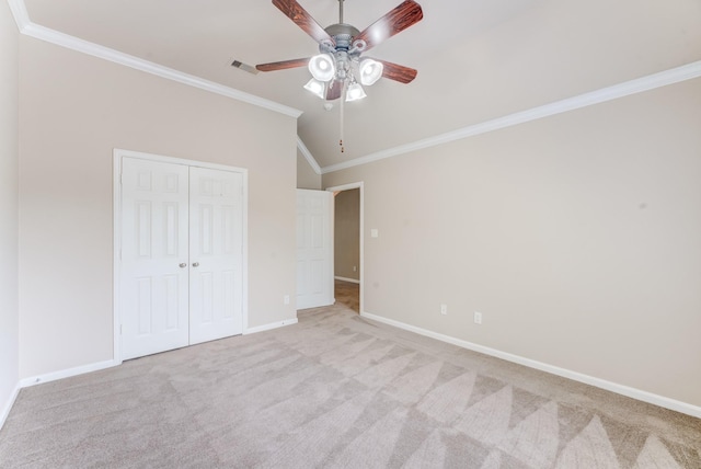 2215 Dali Ln, Missouri City, TX 77459 - unfurnished bedroom with crown molding, carpet flooring, baseboards, a closet, and vaulted ceiling