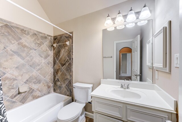 2215 Dali Ln, Missouri City, TX 77459 - bathroom with toilet, vanity, washtub / shower combination, and lofted ceiling