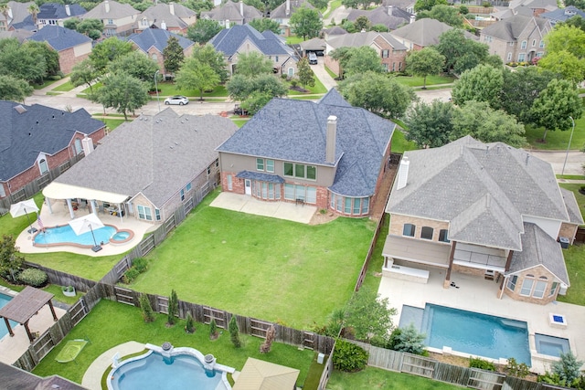 2215 Dali Ln, Missouri City, TX 77459 - aerial view of residential area with a pool area