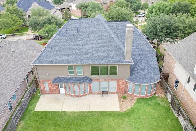 2215 Dali Ln, Missouri City, TX 77459 - rear view of property with brick siding, a shingled roof, a patio, and a chimney