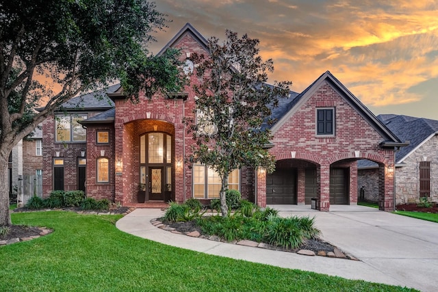 2215 Dali Ln, Missouri City, TX 77459 - view of front of property with brick siding, concrete driveway, a front yard, and a shingled roof