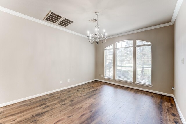 2215 Dali Ln, Missouri City, TX 77459 - spare room with a chandelier, crown molding, baseboards, and dark wood-type flooring