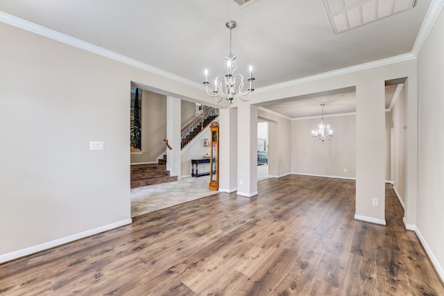2215 Dali Ln, Missouri City, TX 77459 - unfurnished room featuring a chandelier, wood finished floors, crown molding, stairway, and baseboards