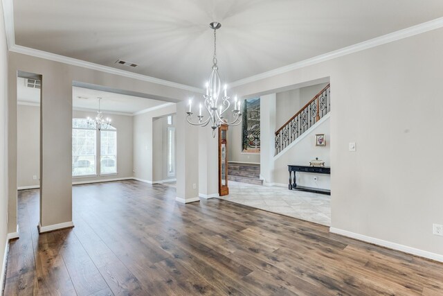 2215 Dali Ln, Missouri City, TX 77459 - unfurnished living room with a chandelier, dark wood finished floors, stairway, crown molding, and baseboards