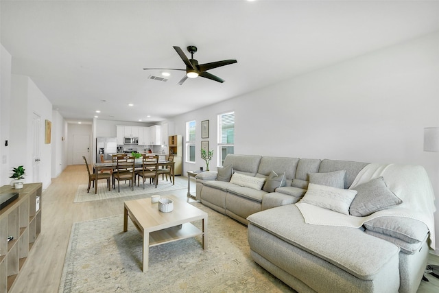 16910 Elm Grove Rd, Conroe, TX 77302 - living area featuring light wood-style floors, a ceiling fan, and recessed lighting