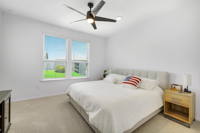 16910 Elm Grove Rd, Conroe, TX 77302 - bedroom with light carpet, baseboards, and a ceiling fan