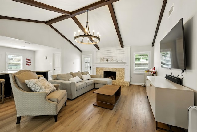 10718 Chevy Chase Dr, Houston, TX 77042 - living area featuring a premium fireplace, light wood finished floors, and a chandelier