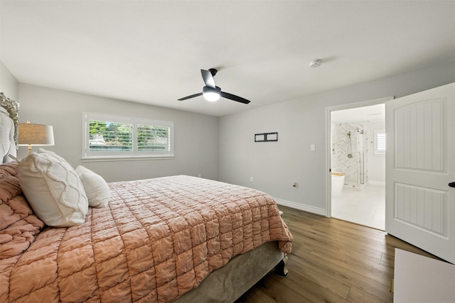 10718 Chevy Chase Dr, Houston, TX 77042 - bedroom featuring multiple windows, wood finished floors, a ceiling fan, and connected bathroom