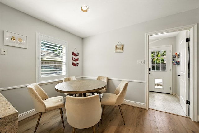 10718 Chevy Chase Dr, Houston, TX 77042 - dining room featuring light wood-style flooring and baseboards
