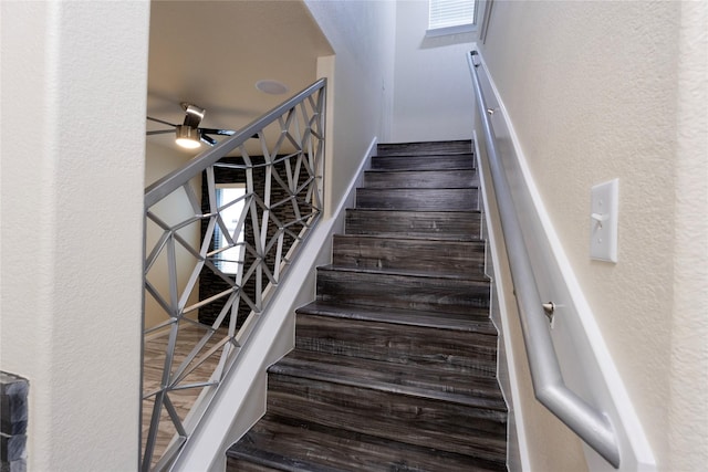6442 Wilshire Lks, Houston, TX 77040 - stairway with arched walkways, a ceiling fan, and a textured wall
