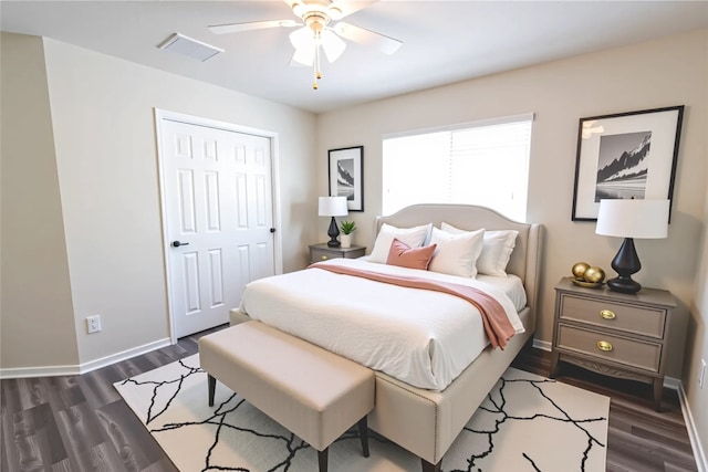 6442 Wilshire Lks, Houston, TX 77040 - bedroom with dark wood-style floors, a ceiling fan, and a closet