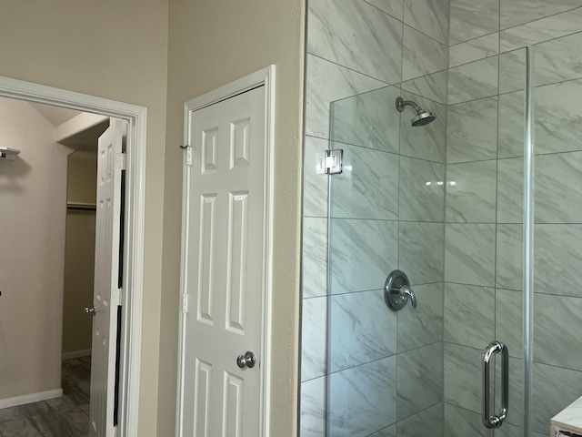 6442 Wilshire Lks, Houston, TX 77040 - bathroom featuring a shower stall and marble look tile flooring