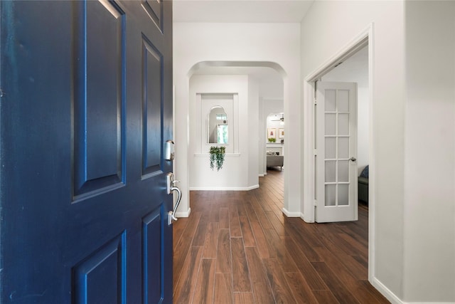 2 Bayou Springs Ct, Spring, TX 77382 - foyer with arched walkways, dark wood-type flooring, and baseboards