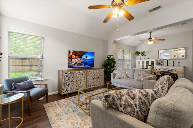 2 Bayou Springs Ct, Spring, TX 77382 - living room featuring a ceiling fan, lofted ceiling, dark wood-style flooring, baseboards, and arched walkways