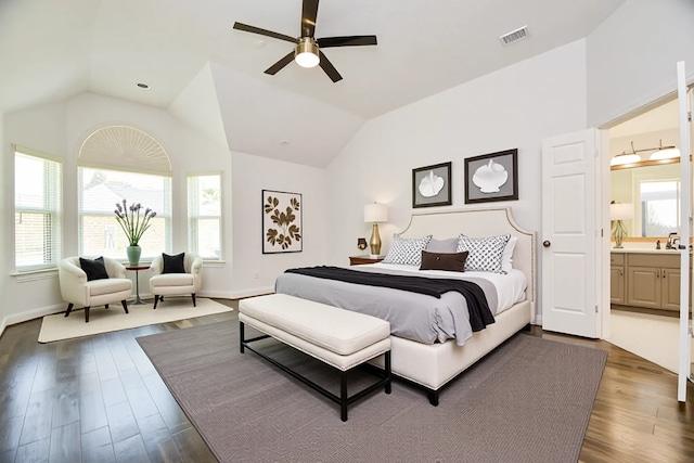 6402 Amelia Springs Dr, Spring, TX 77379 - bedroom featuring dark wood finished floors, vaulted ceiling, baseboards, ensuite bathroom, and a ceiling fan