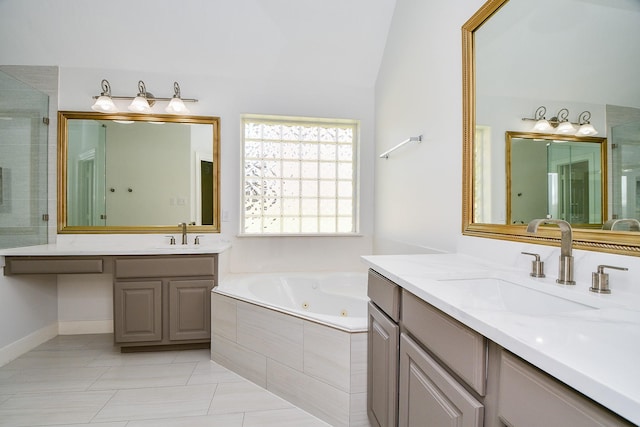 6402 Amelia Springs Dr, Spring, TX 77379 - full bathroom featuring a jetted tub, two vanities, a shower stall, vaulted ceiling, and tile patterned floors