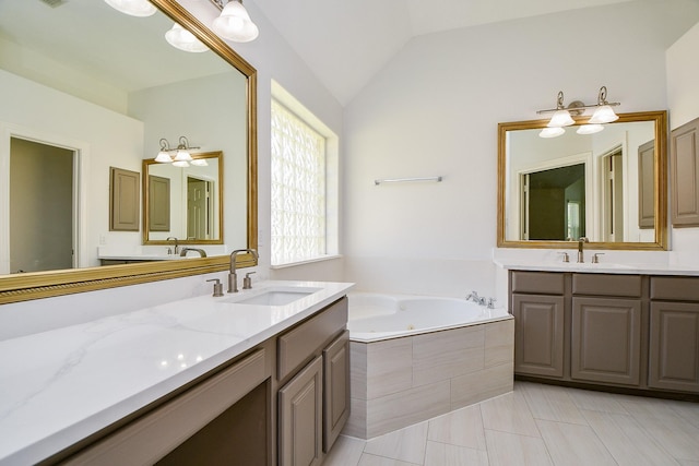 6402 Amelia Springs Dr, Spring, TX 77379 - full bathroom featuring two vanities, a tub with jets, tile patterned flooring, and lofted ceiling