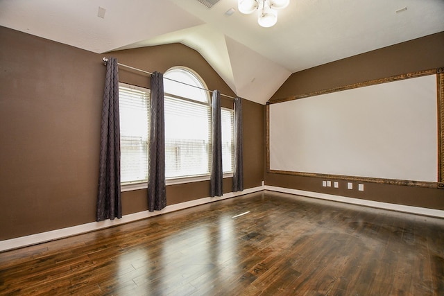 6402 Amelia Springs Dr, Spring, TX 77379 - spare room featuring vaulted ceiling, wood finished floors, baseboards, and a chandelier