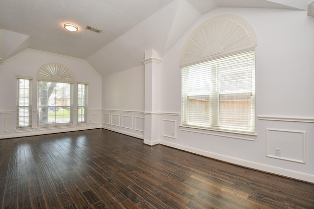 6402 Amelia Springs Dr, Spring, TX 77379 - spare room featuring vaulted ceiling, a wainscoted wall, and dark wood-style floors