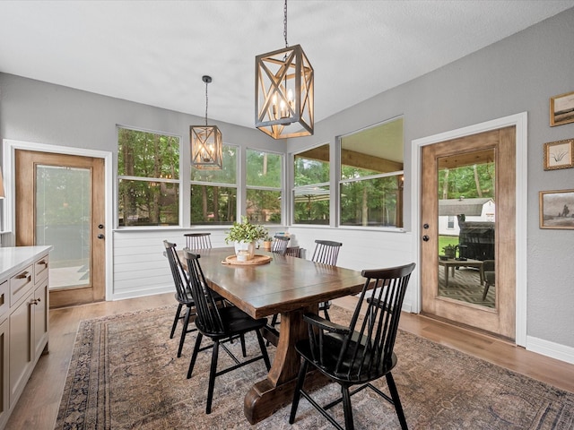32363 Spinnaker Run, Magnolia, TX 77354 - dining area with wood finished floors, a chandelier, and baseboards