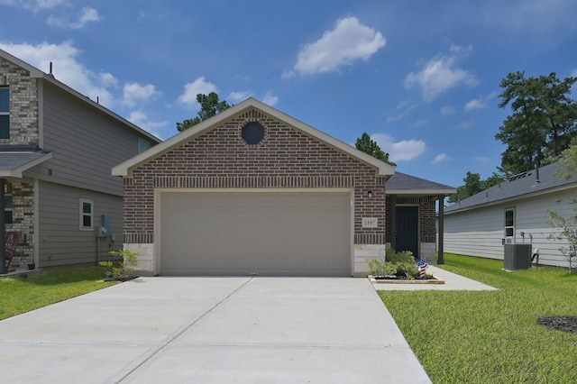 1887 Brushy Cedar Dr, Conroe, TX 77301 - single story home featuring brick siding, a garage, a front lawn, driveway, and central AC unit