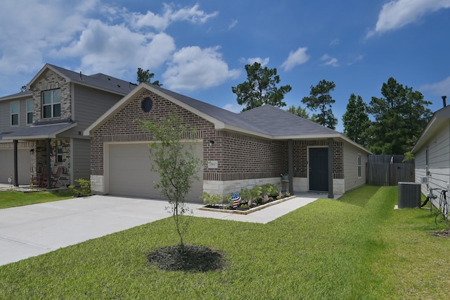 1887 Brushy Cedar Dr, Conroe, TX 77301 - view of front of property featuring brick siding, an attached garage, concrete driveway, cooling unit, and stone siding
