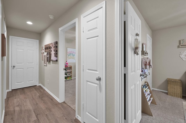 1887 Brushy Cedar Dr, Conroe, TX 77301 - hall with baseboards, dark wood-style floors, and recessed lighting