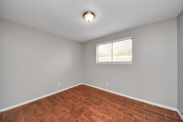 9422 Val Verde St, Houston, TX 77063 - empty room with dark wood-style floors and baseboards