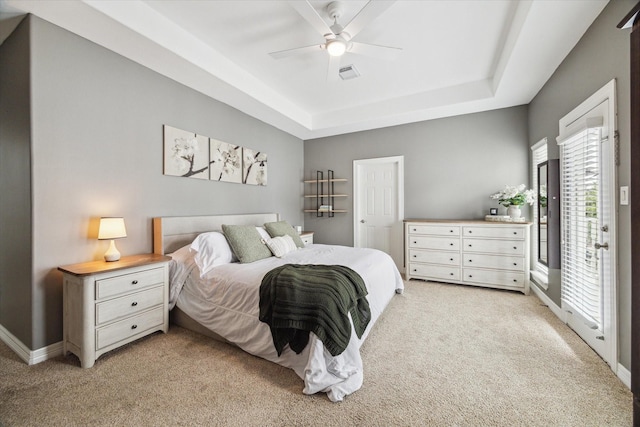 818 Garden Rose Ln, Houston, TX 77018 - bedroom featuring light colored carpet, a tray ceiling, access to outside, and a ceiling fan
