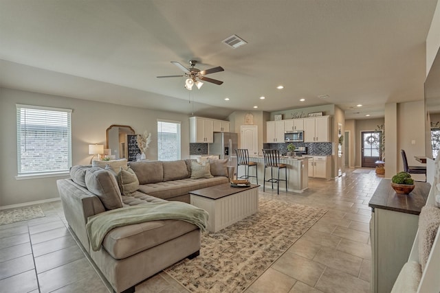 13919 Leigh Lake Ln, Conroe, TX 77384 - living area featuring a ceiling fan, light tile patterned flooring, and recessed lighting