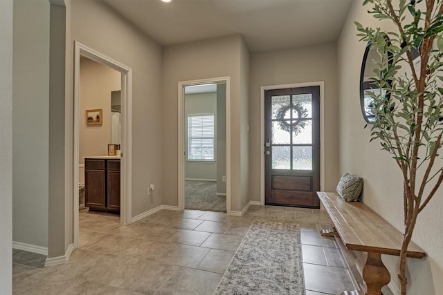 13919 Leigh Lake Ln, Conroe, TX 77384 - entryway featuring light tile patterned flooring and baseboards