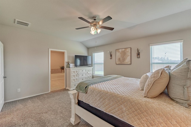 13919 Leigh Lake Ln, Conroe, TX 77384 - carpeted bedroom with vaulted ceiling, ceiling fan, and connected bathroom