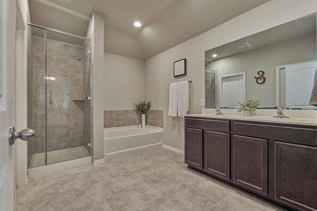 13919 Leigh Lake Ln, Conroe, TX 77384 - full bath with a bath, a shower stall, double vanity, vaulted ceiling, and tile patterned floors