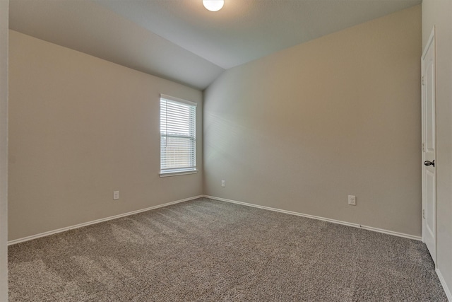 13919 Leigh Lake Ln, Conroe, TX 77384 - carpeted empty room featuring vaulted ceiling and baseboards