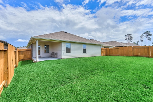 13919 Leigh Lake Ln, Conroe, TX 77384 - rear view of house featuring a patio area, a fenced backyard, and roof with shingles