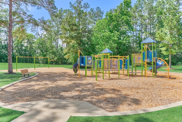 13919 Leigh Lake Ln, Conroe, TX 77384 - community jungle gym with view of scattered trees