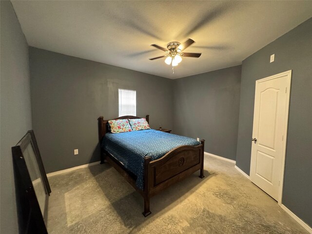000 Old Fm 705, Broaddus, TX 75929 - carpeted bedroom with baseboards and a ceiling fan