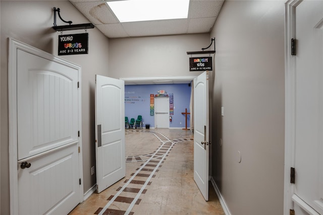2027 Fm 1942nd Rd, Crosby, TX 77532 - hall featuring inlaid floor details, baseboards, and a paneled ceiling